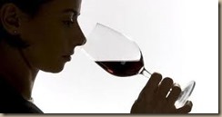 person smelling wine